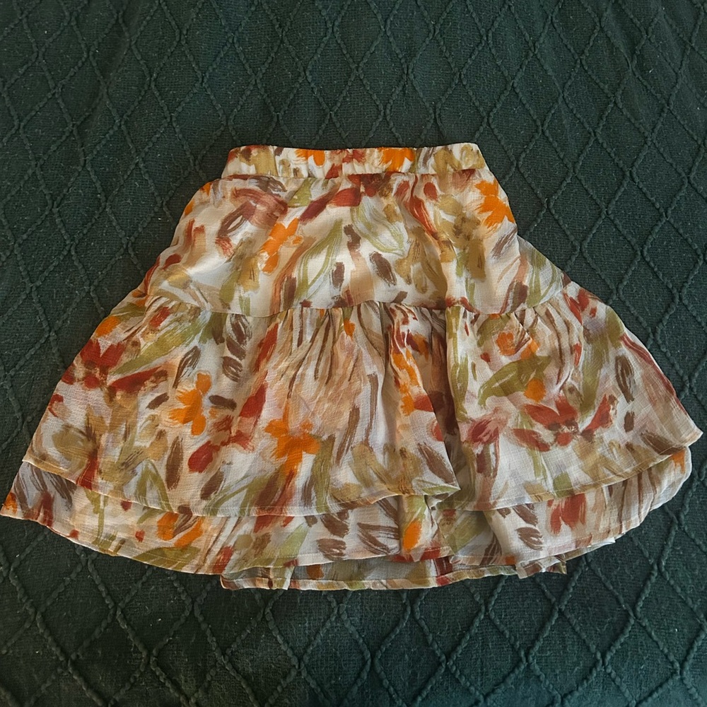 orange and white floral mini skirt